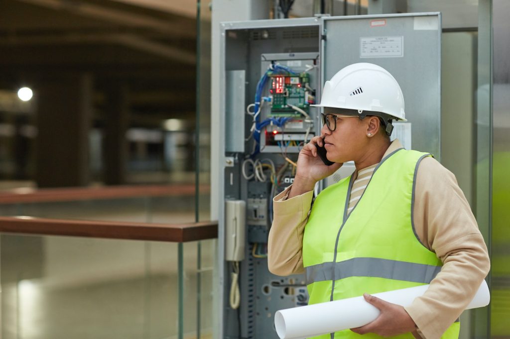 Female Engineer Inspecting Electric Systems